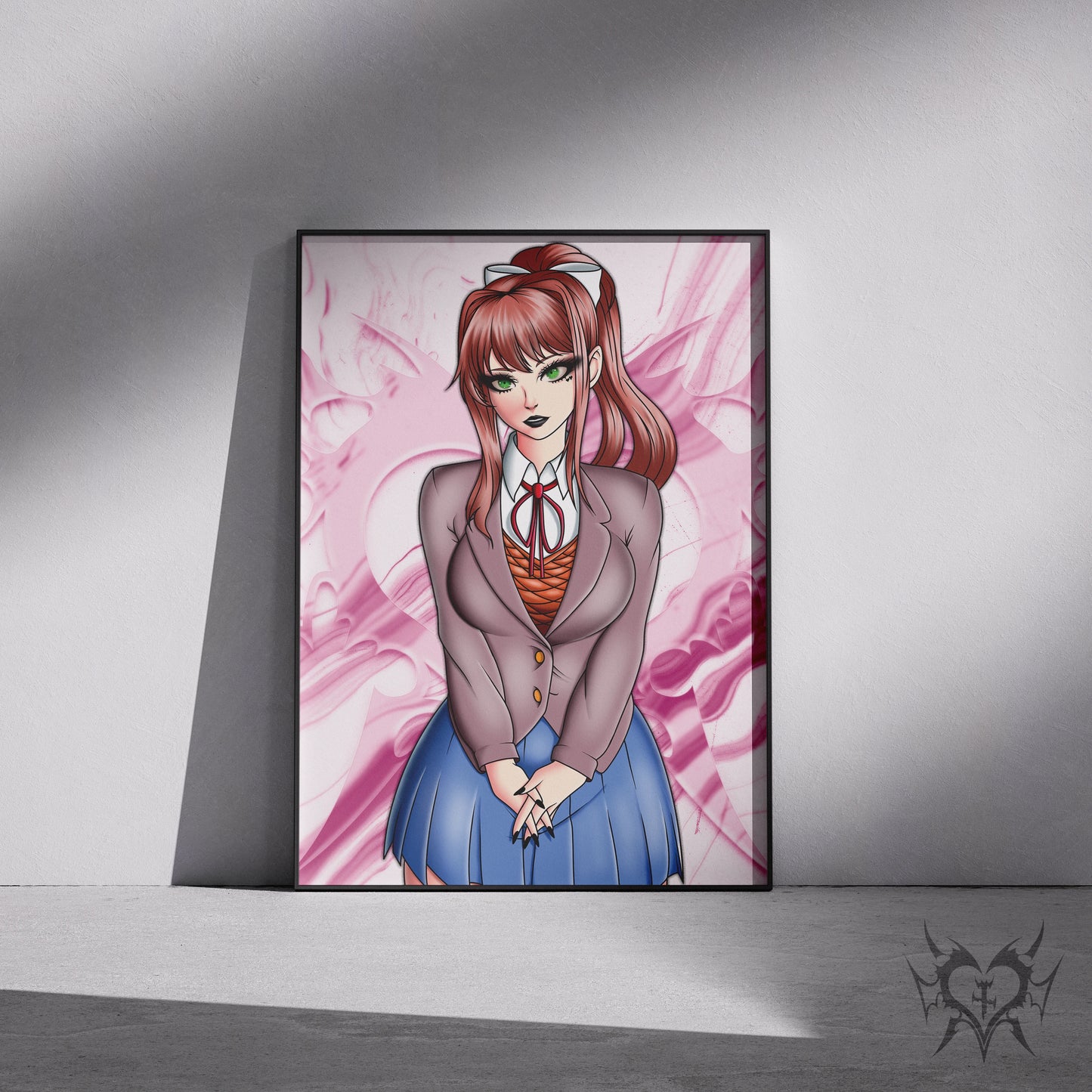 Framed Monika anime art print displayed in a black 11x17 frame leaning against a wall.