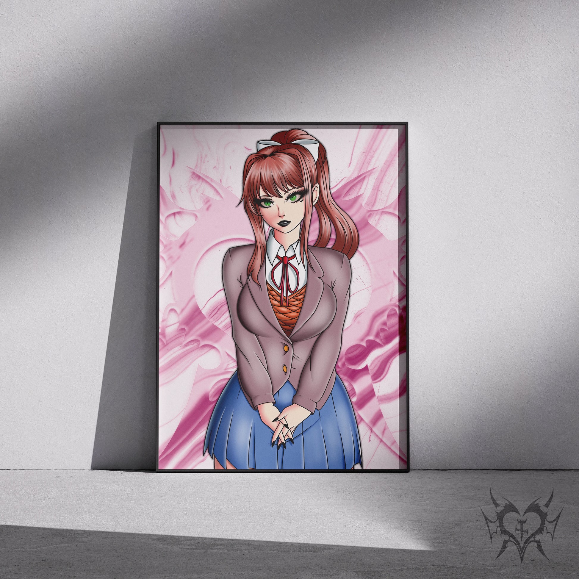 Framed Monika anime art print displayed in a black 11x17 frame leaning against a wall.